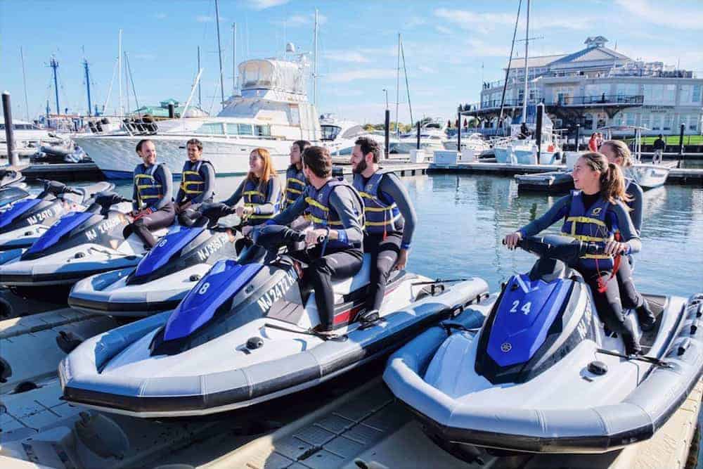 a group of people on jet skis in the water